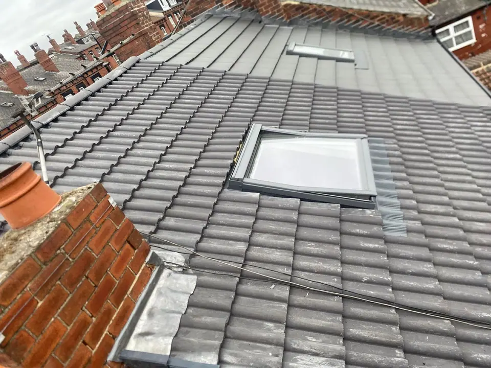 Finished tiled roof slope with roof windows and leadwork