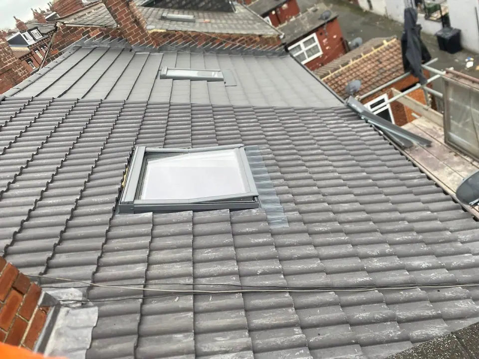 Roof windows set into a finished charcoal tiled roof